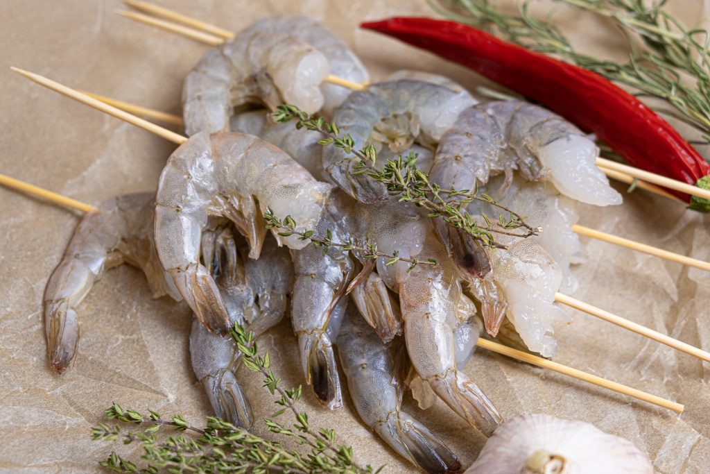 Close up of raw shrimps on a baking paper Close up of raw shrimps on a baking paper.